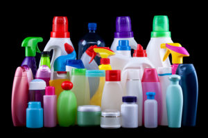 Usual plastic bottles from a household isolated on black - pollution and environment concept
